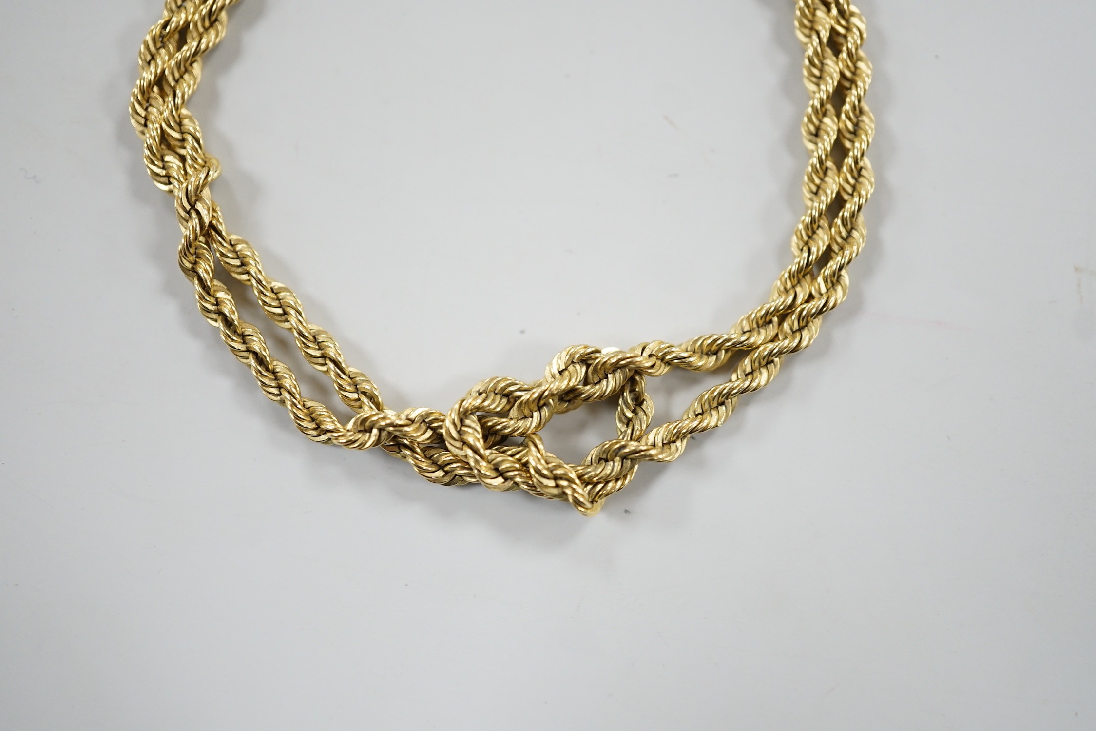 A modern yellow metal twin stand rope twist bracelet, 18cm, 17.4 grams.